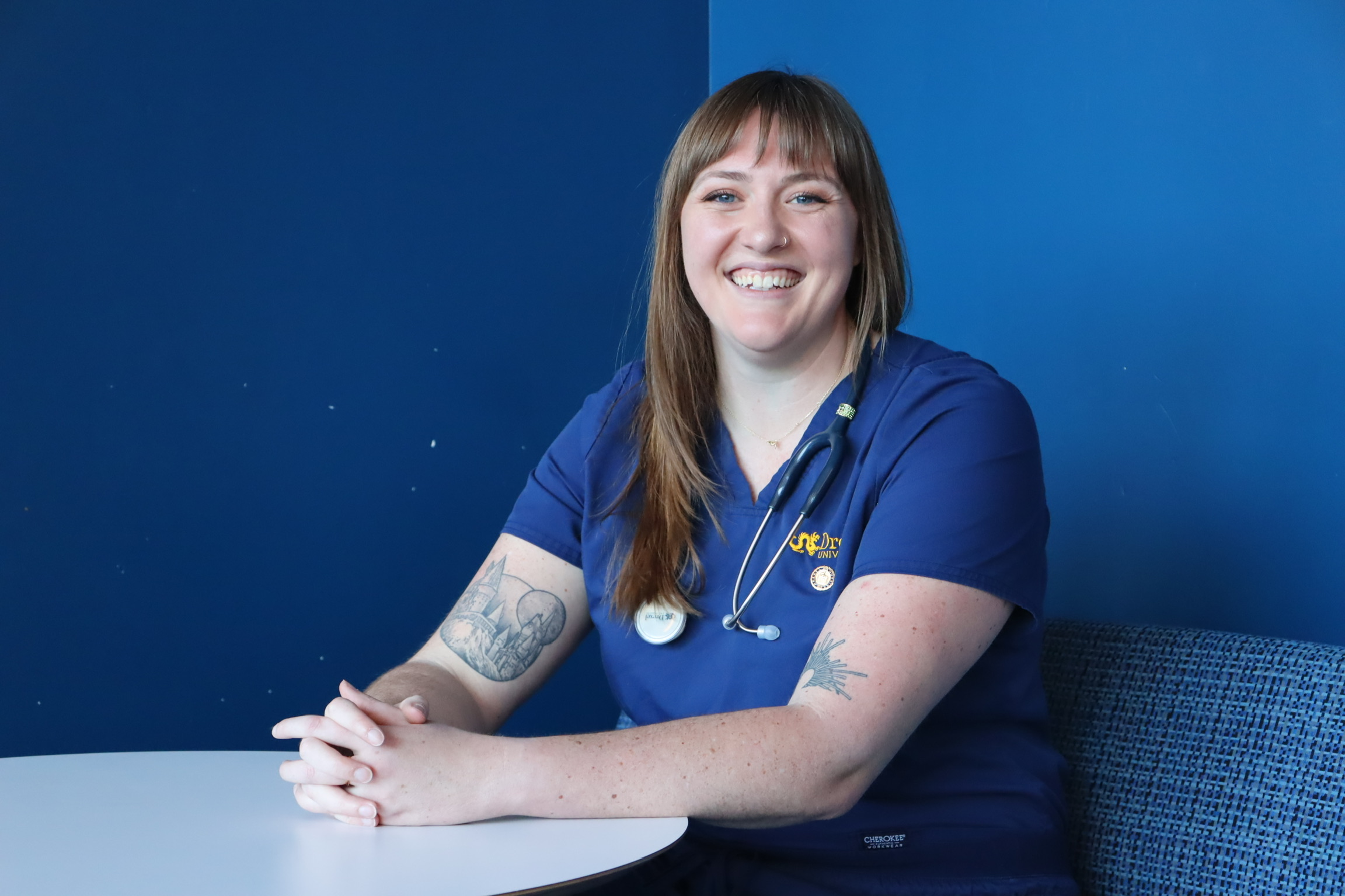 Stella Willoughby in scrubs with stethoscope